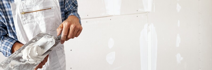 Drywall repair being performed by an experienced Affordable Painting and Furniture Assembly drywall technician.